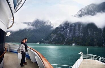 Couple at the Rail on the Ruby Ship in Tracy Arm Fjord Juneau Alaska